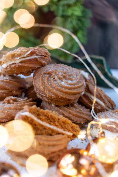 istock Christmas ginger cream-filled cookies with greenery 1090606548