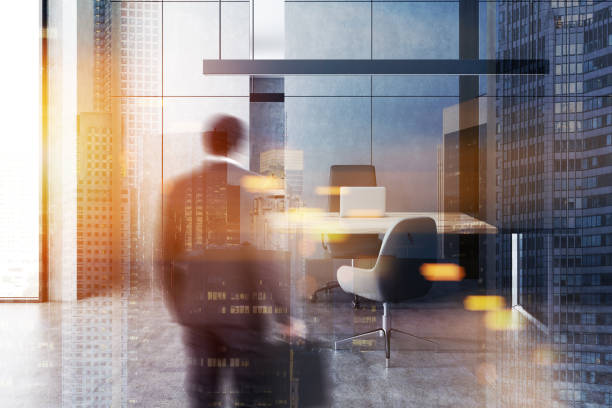 istock Man in minimalistic manager office, gray walls 1090608880