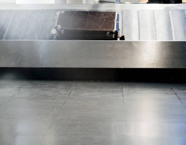 istock Conveyor belt with one suitcase left in modern airport 1090610102