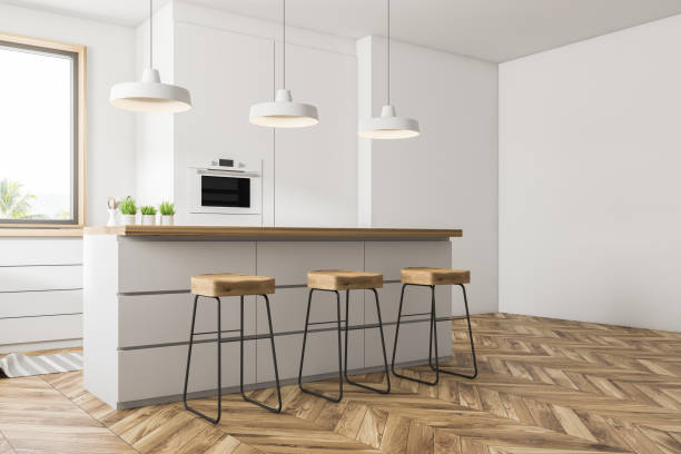 istock Corner of white kitchen with bar 1090610278