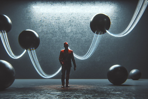 Abstract businessman with wired spheres.
