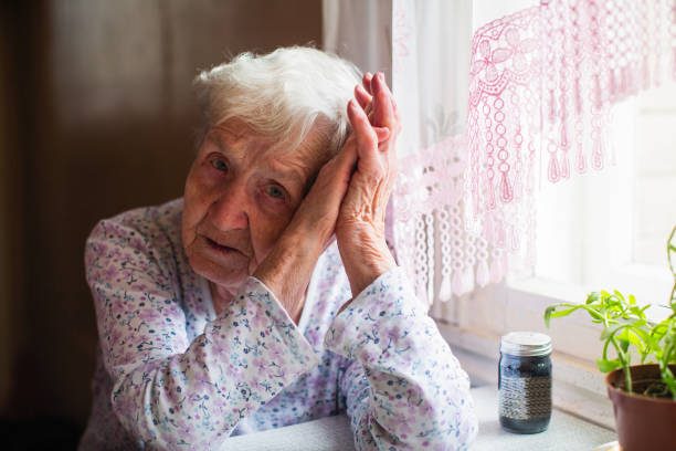 istock Sad elderly woman sitting in her home. 1090612904