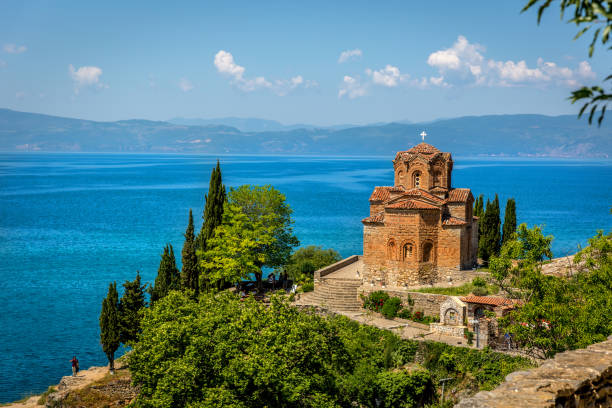 An orthodox church in Ohrid An orthodox church with the beautiful Ohrid lake in a blue sky day north macedonia stock pictures, royalty-free photos & images