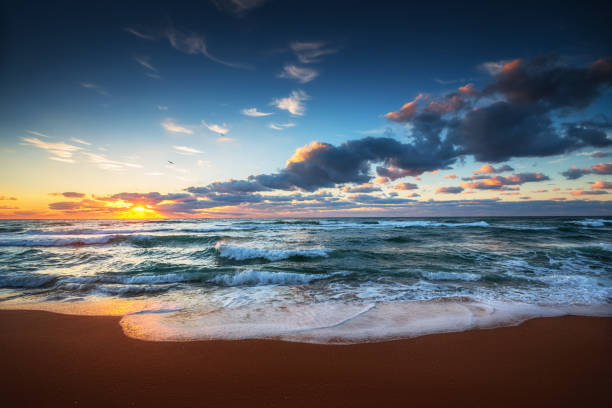 istock Beautiful cloudscape over the sea waves, sunrise shot 1090613232