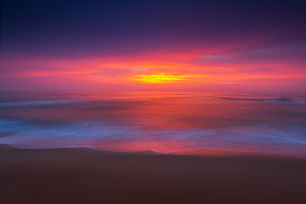 istock Sea sunrise with burning sky over the beach 1090614622
