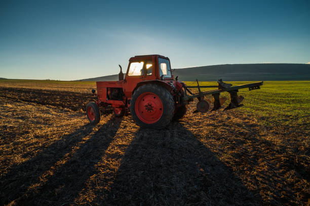 istock Tractor cultivating field at spring. Agriculture work. 1090614650