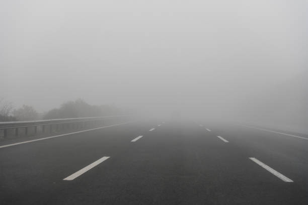 istock Empty Highway in a Foggy Weather 1090618520