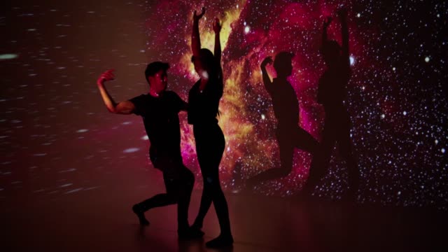 Space projection upon dancer couple