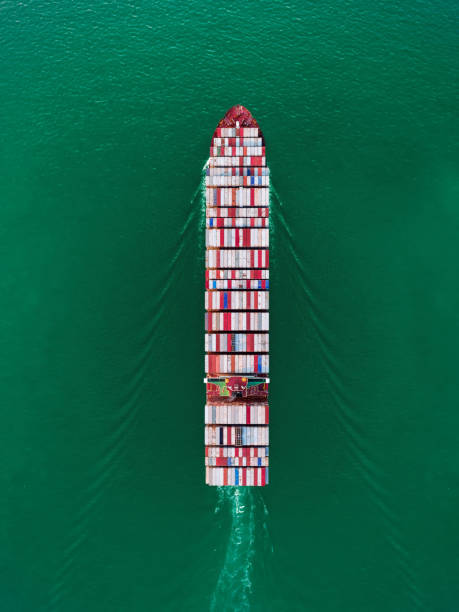istock Aerial top view container ship on the sea full load container for import export, shipping or transportation. 1090645216