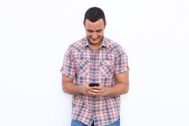 istock happy man looking at mobile phone by isolated white background 1090648280