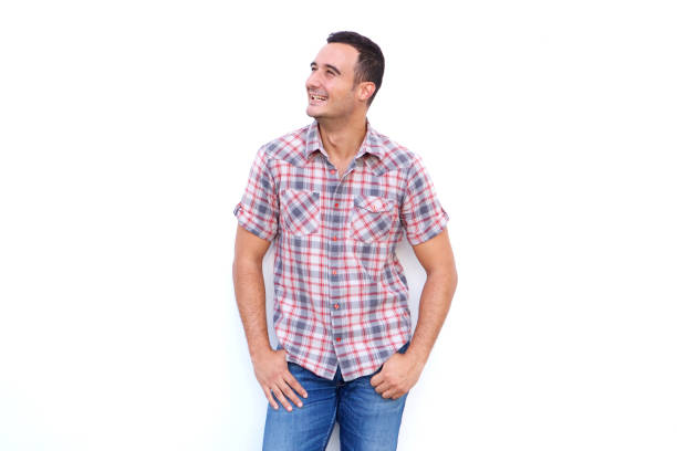 istock older guy smiling and looking away against isolated white background 1090648292