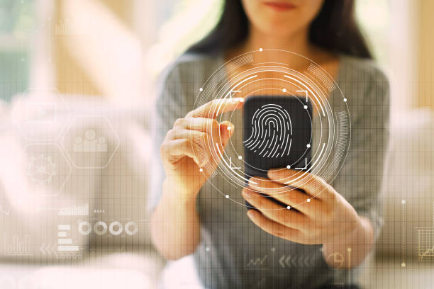 tecnologia di scansione delle impronte digitali con donna che utilizza uno smartphone - biometrics accessibility control fingerprint foto e immagini stock