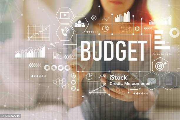 Budget With Woman Using A Smartphone Stock Photo - Download Image Now - Budget, Planning, Business