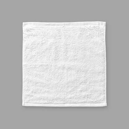 White cotton towel mock up template square size fabric wiper isolated on grey background with clipping path, flat lay top view