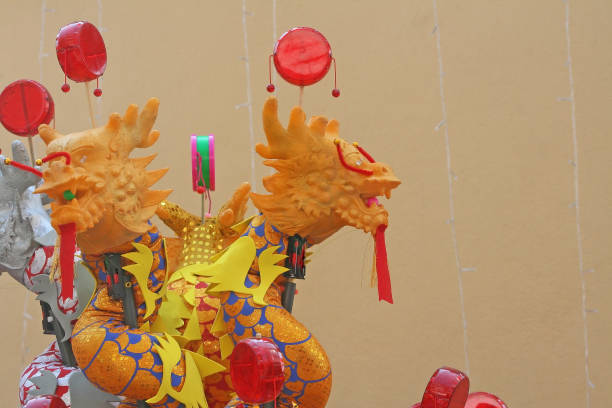 istock Colorful chinese dragon toys on wall background ,( pong-paeng ) 1090652598