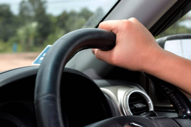 istock hand women driving car 1090653230