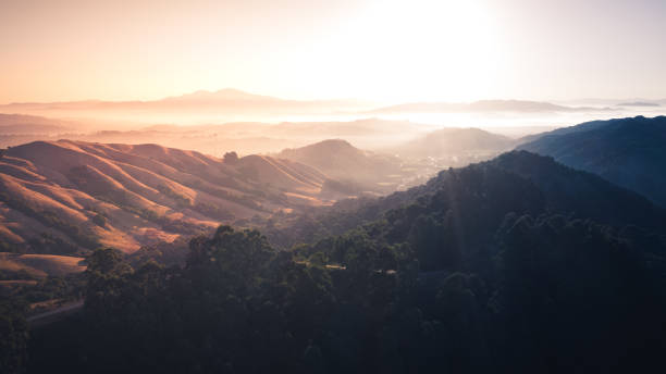 Sunrise over a mountain landscape Sunrise over a mountain landscape.  Berkeley hills glowing with sun rays with Mount Diablo in the distance. berkeley california stock pictures, royalty-free photos & images