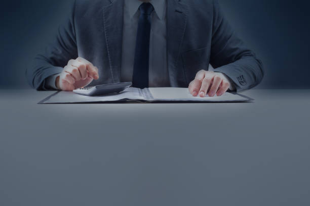 istock Businessman Doing Accounting and Paperwork at Desk 1090676844