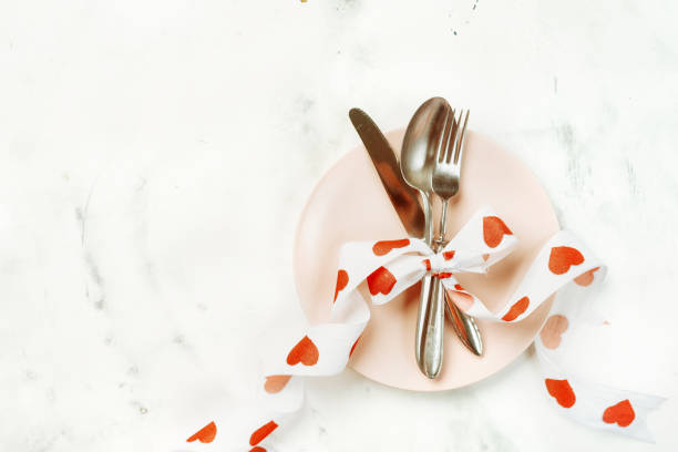 istock Festive table setting with cutlery and pink plate for Valentines Day 1090685584