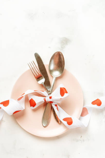 istock Festive table setting with cutlery and pink plate for Valentines Day 1090685670