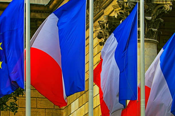 istock French flags pattern and Euro flag waving against classical facade – Paris, France 1090688644