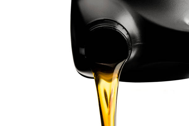 istock Pouring car oil  from bottle isolated on white background 1090694178