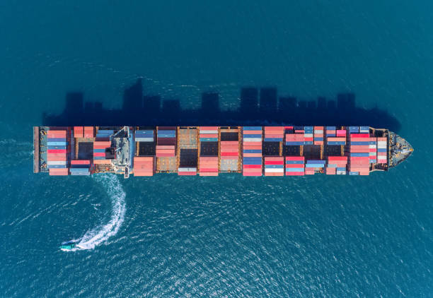 istock Aerial top view container ship at sea port for logistics import export, shipping or transportation. 1090718614