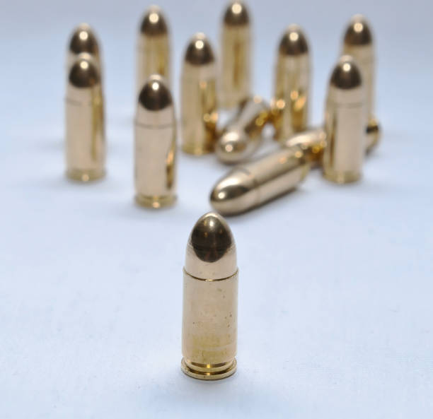 istock Thirteen gold full metal jacket 9mm bullets 1090720942