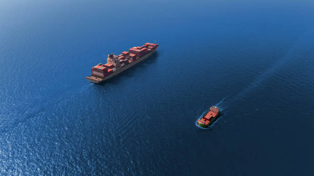 istock Aerial view container ship at the sea full load container for  logistics import export, shipping or transportation. 1090721066