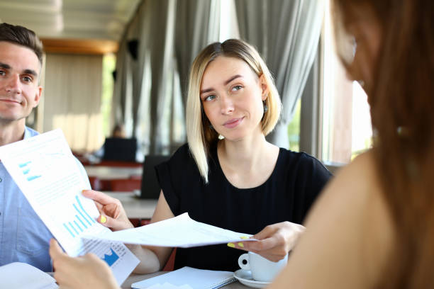 istock Group of people hold in arms financial papers solve 1090722858