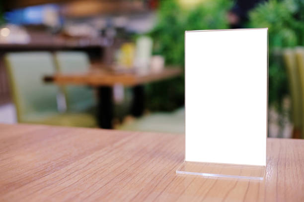 istock Menu frame standing on wood table in Bar restaurant cafe. space for text marketing promotion. 1090722930