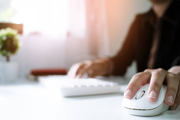 istock Woman working by using a laptop computer on wooden table. Hands typing on a keyboard 1090723002
