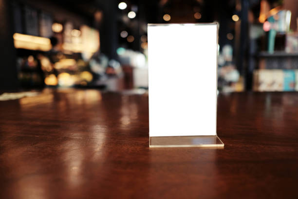 istock Menu frame standing on wood table in Bar restaurant cafe. space for text marketing promotion. 1090726974