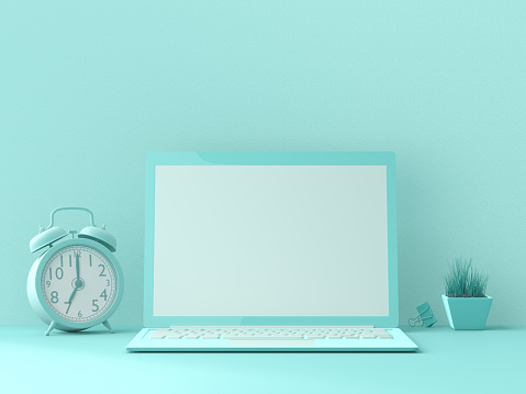 minimal idea concept, Laptop  mock-up on Work desk with clock, binder clip and Small tree blue color on blue background. 3d render.