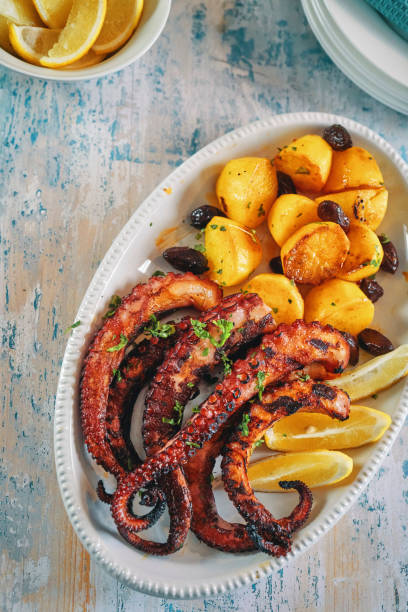 istock Octopus Tentacles with Potatoes and Fresh Lemon 1090731976