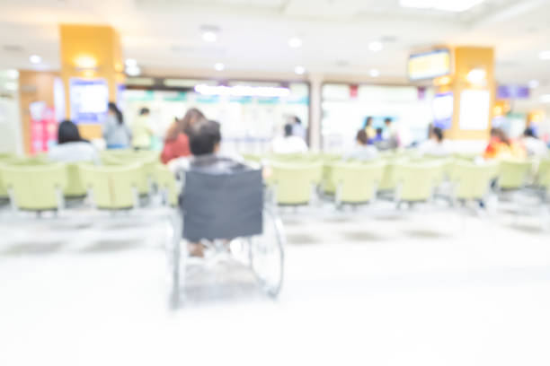 istock abstract blurry image of people in hospital. 1090740812
