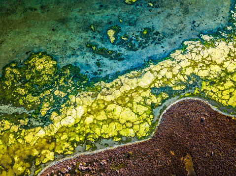 Aerial views of Nangudga lake with all its flora and extures and interesting colour. This saline coastal lagoon has an intermittently closed entrance.