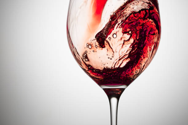istock Stream of wine being pouring into a glass. 1090745794