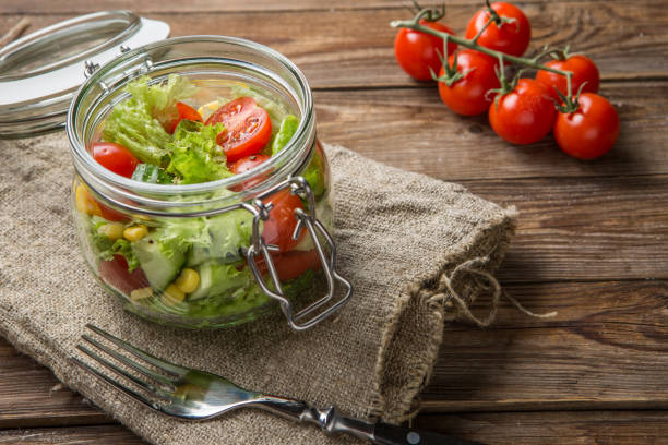 istock Vegetable salad on wooden table 1090746880