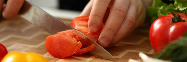 istock Cook holds knife in hand and cuts on 1090750146