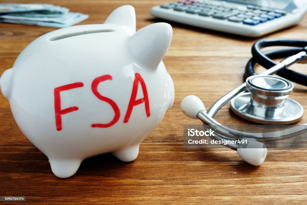 Piggy bank with words Flexible Spending Account FSA. Commercial Activity Stock Photo