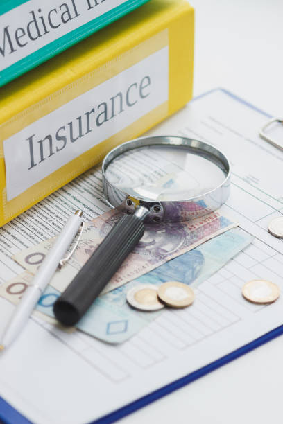 istock Clean insurance form, magnifying glass and money, soft focus background 1090757448