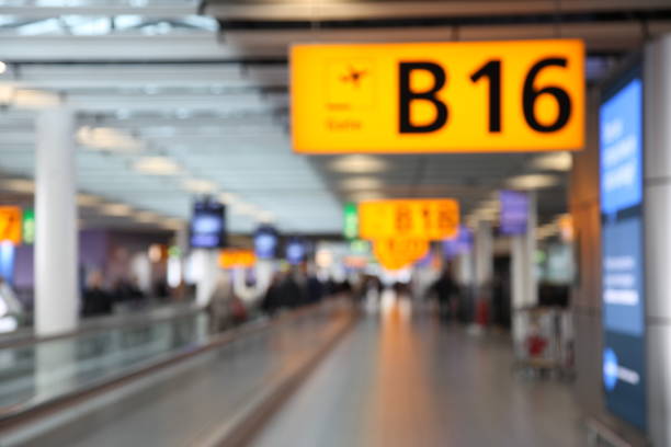 istock Defocused airport passengers crowd walking blurred people 1090764096