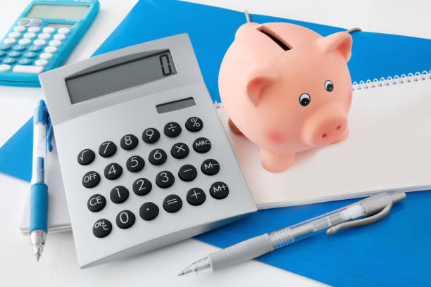 istock Office desk and piggy bank 1090765956