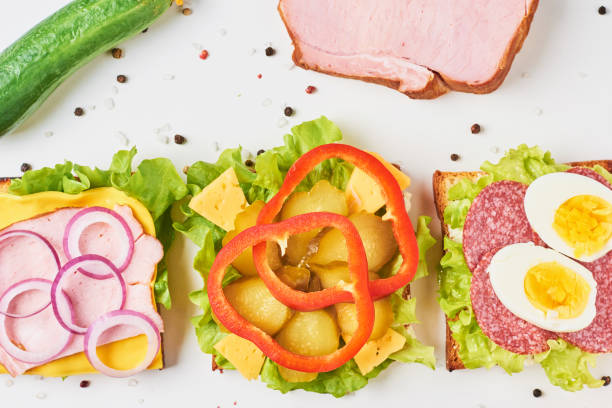 istock Different kind of sandwich and ingredients on a white background, top view 1090773048