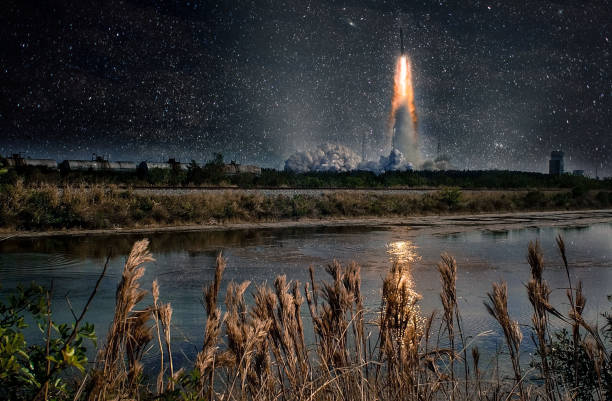 Missile launch at night. Tranquil nature landscape and reflection in the creek. The elements of this image furnished by NASA. Missile launch at night. Tranquil nature landscape and reflection in the creek. The elements of this image furnished by NASA. missile photos stock pictures, royalty-free photos & images