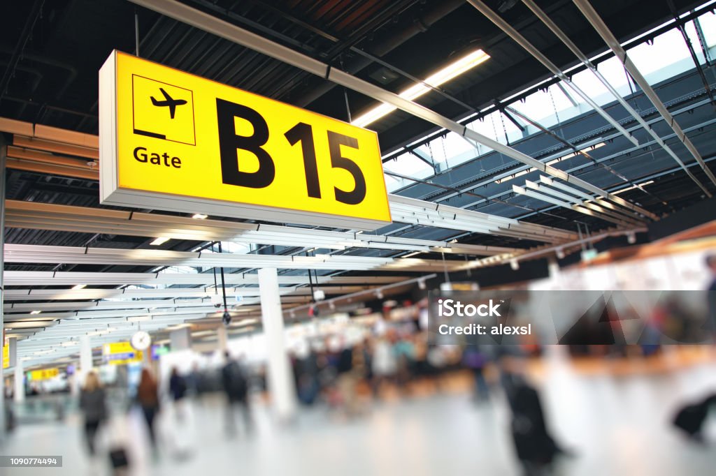 Airport terminal passengers crowd walking in Amsterdam Schiphol, Netherlands Amsterdam Schiphol Airport Stock Photo