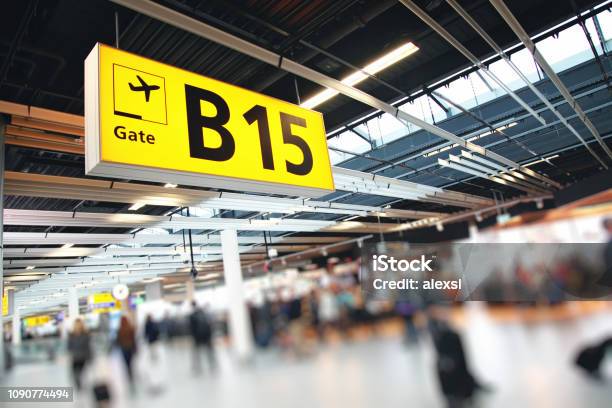 Airport Terminal Passengers Crowd Walking In Amsterdam Schiphol Netherlands Stock Photo - Download Image Now