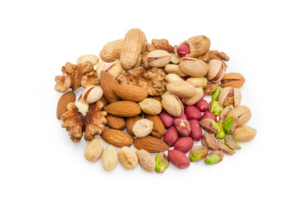 istock Pile of the various nuts on a white background 1090786224