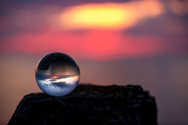 istock Upside down sunset landscape at Cape Kaliakra, Bulgaria, Eastern Europe - reflection in a lensball - selective focus, space for text 1090788596